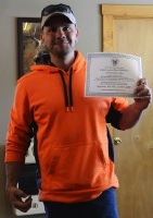 Chris Cullen shows off his puppy Tuck's First Time Participant certificate.jpg
