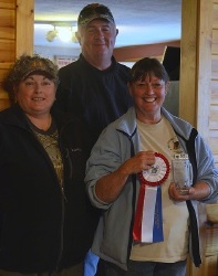 Linda Sorak accepts Laser's Junior Retriever ribbon & award.jpg